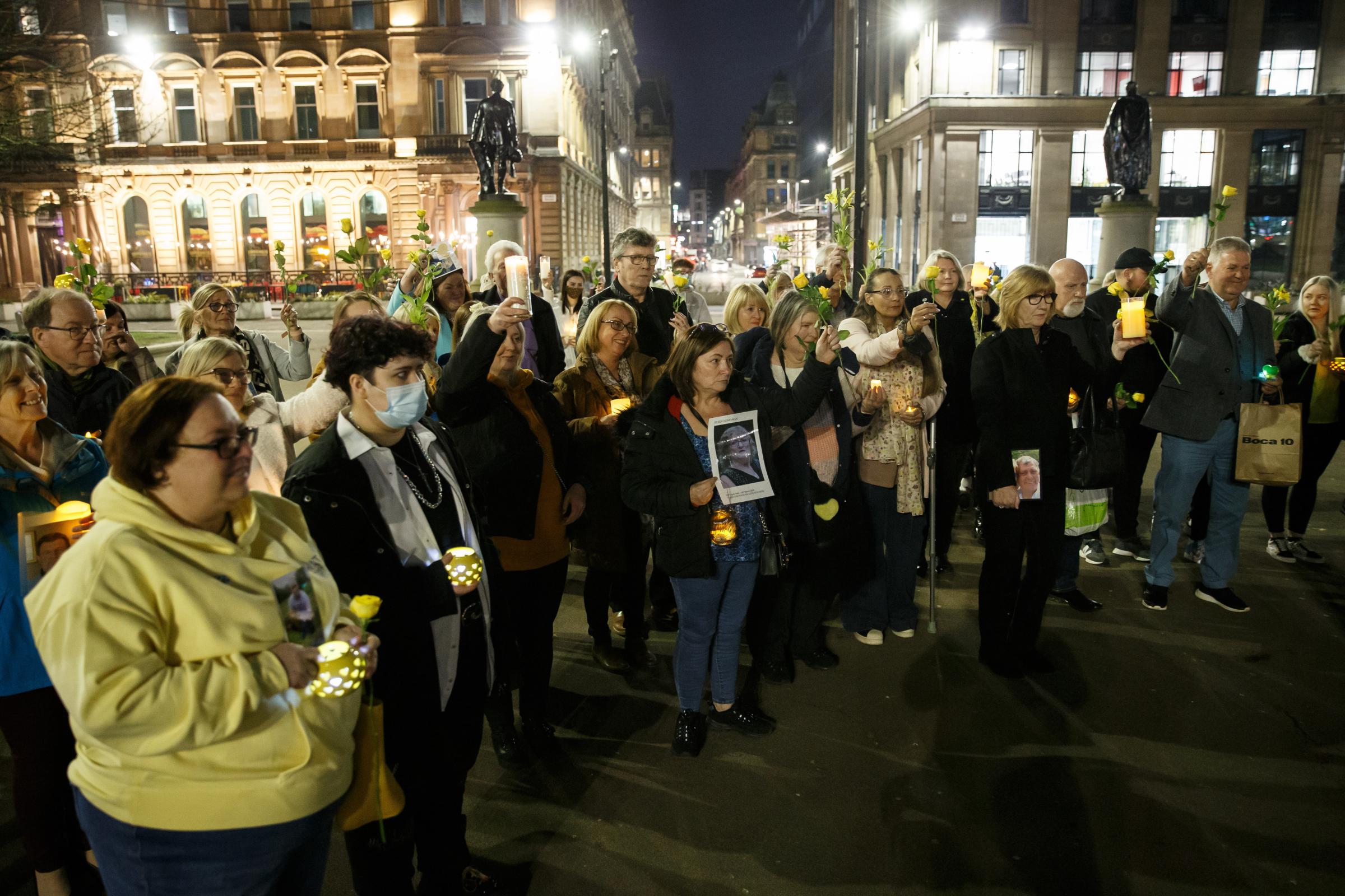 Vigil at George Square, Glasgow to mark the second national lockdown anniversary. The event attended by families who lost loved ones in the covid pandemic was organised by Covid 19 Families Scotland. Photograph by Colin Mearns.