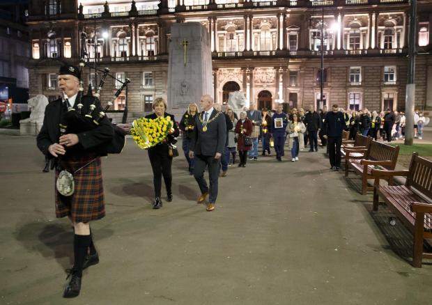 HeraldScotland: A piper led those gathered across George Square and among those attending was the city's Lord Provost Philip Braat.