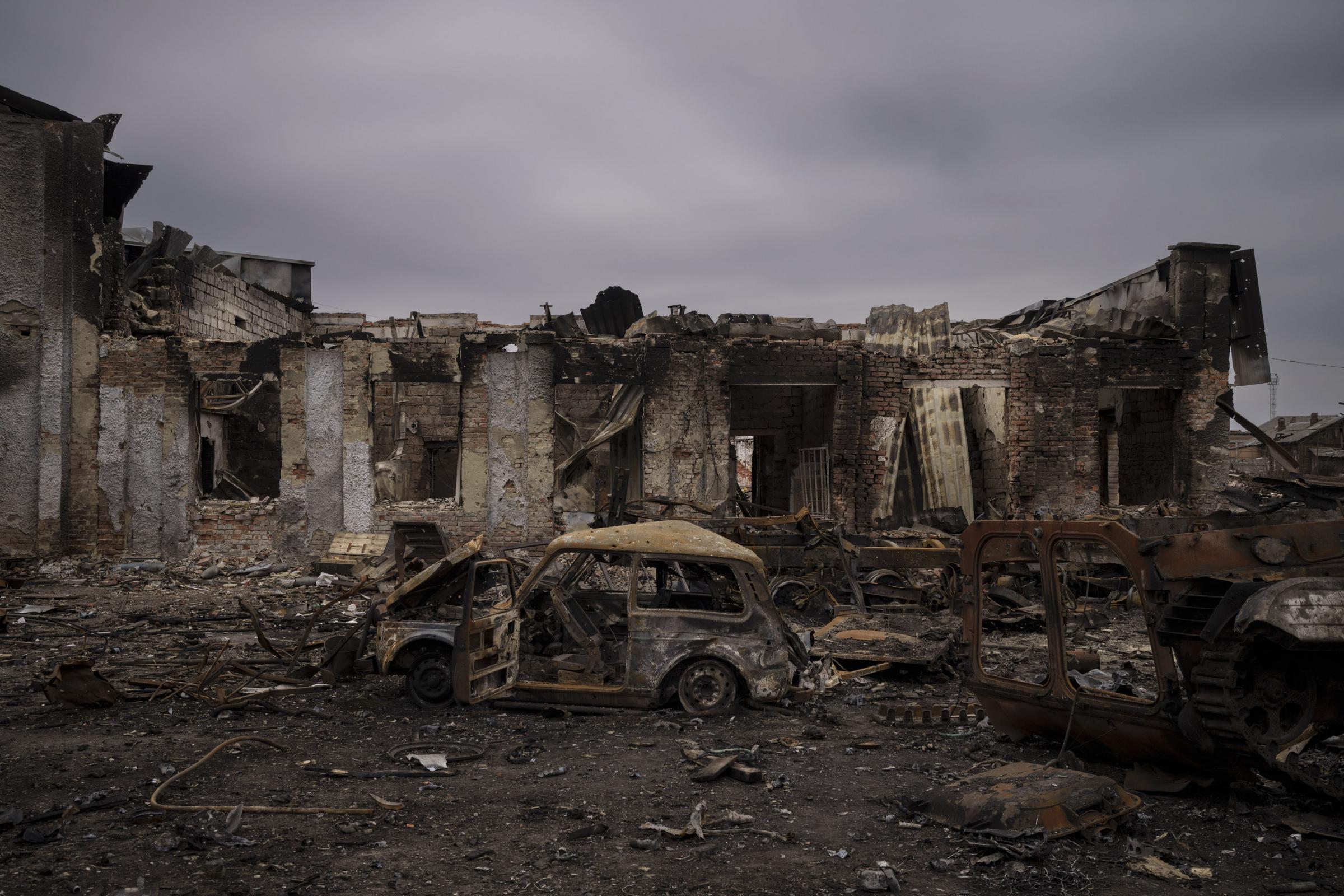 Destroyed vehicles and buildings are seen in the town of Trostsyanets, Ukraine.