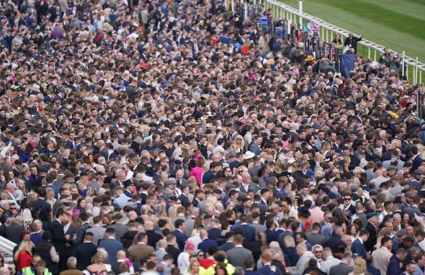 HeraldScotland: The crowds have returned to Aintree for today's Grand National. Picture: PA