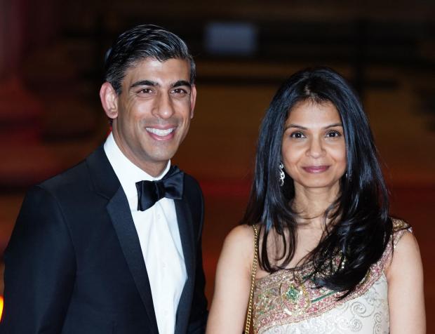 HeraldScotland: The Chancellor of the Exchequer Rishi Sunak pictured with his wife Akshata Murty Ian West PA Wire