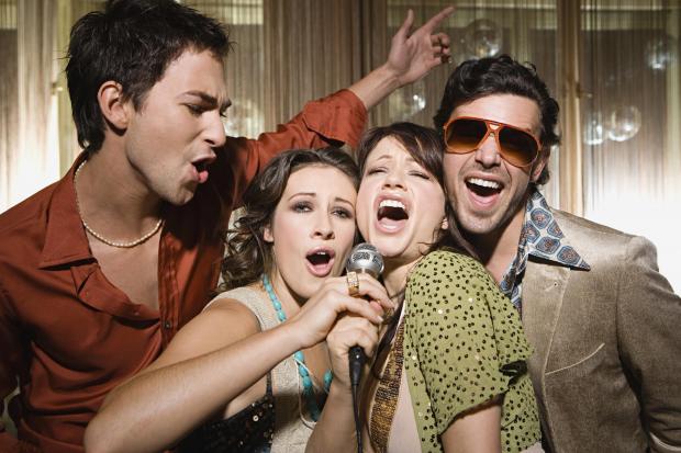 A group enjoys karaoke. Picture: Getty