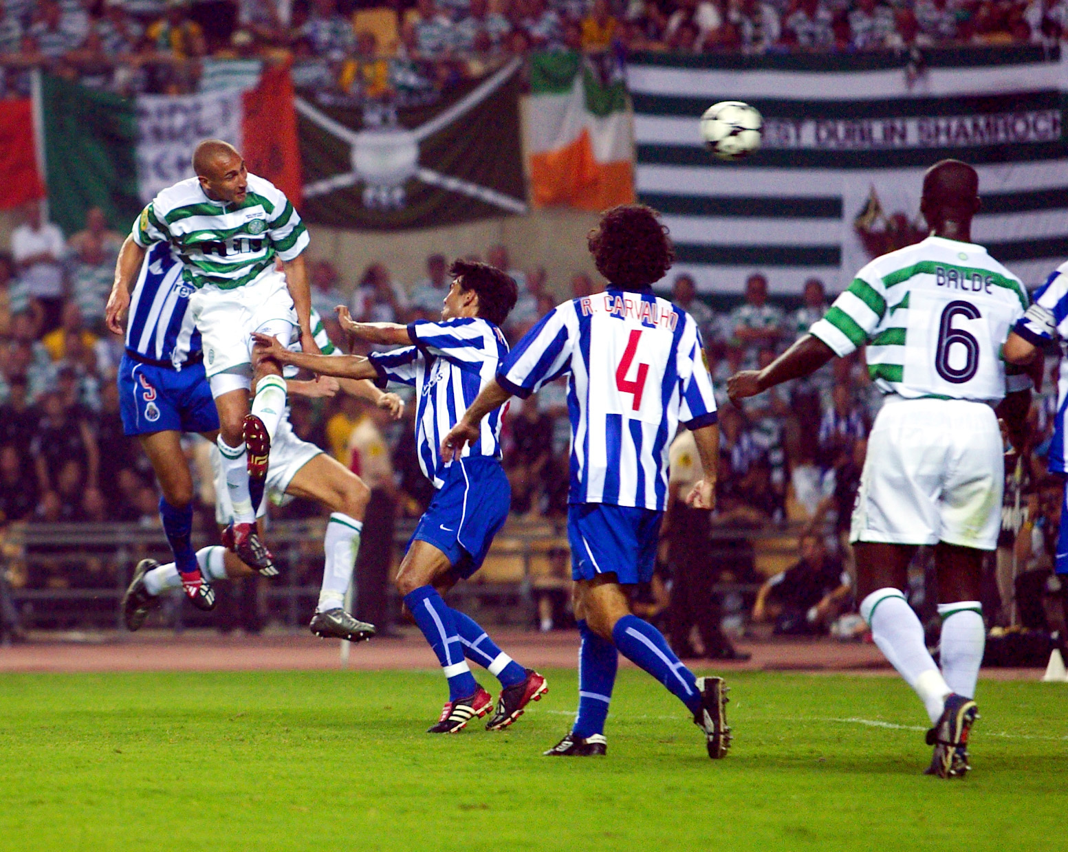 Henrik Larsson (left) scores for Celtic in the Uefa Cup final