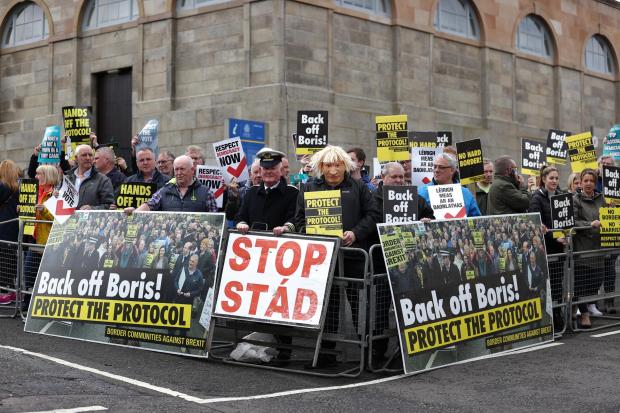 Boris Johnson facing protesters as he arrives for talks with Stormont leaders