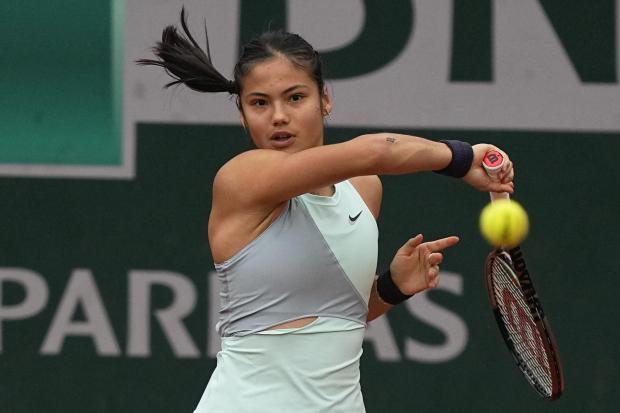 Britain's Emma Raducanu plays a shot against Linda Noskova of the Czech Republic during their first round match at the French Open tennis tournament in Roland Garros stadium in Paris, France, Monday, May 23, 2022. (AP Photo/Michel Euler).