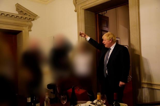 Boris Johnson at a gathering in 10 Downing Street for the departure of a special adviser 
(Picture: Sue Gray report/Cabinet Office/PA)