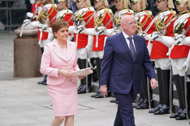 HeraldScotland: First Minister Nicola Sturgeon accompanied by her husband Peter Murrell
