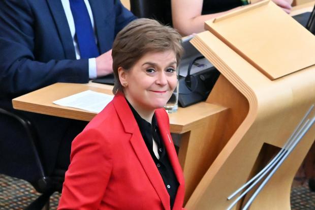 Nicola Sturgeon smiles during First Minister's Questions in the Scottish Parliament, on June 30, 2022 in Edinburgh. (Photo by Ken Jack/Getty Images).