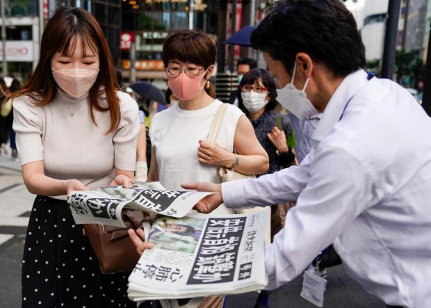 HeraldScotland: Extra edition newspapers about Japan's former Prime Minister being shot while campaigning in Nara