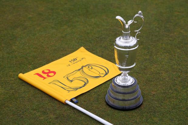 HeraldScotland: ST ANDREWS, SCOTLAND - APRIL 26: The Claret Jug sits on the 18th green at St Andrews Old Course on April 26, 2022 in St Andrews, Scotland. The 150th Open Championship will take place on The Old Course at St Andrews between the 14th and 17th July. (Photo