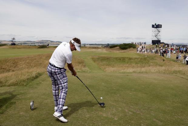 HeraldScotland: Ian Poulter ties off during practice day for the 150th Open Championship
