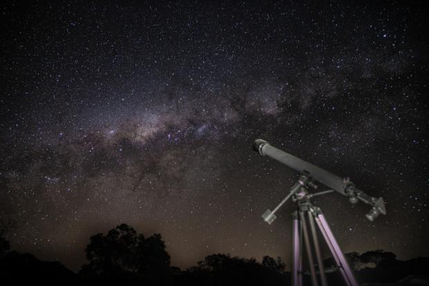 HeraldScotland: A telescope pointed to the stars. Credit: Canva