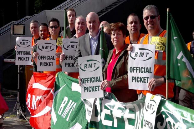 RMT general secretary Mick Lynch on a picket line of his members