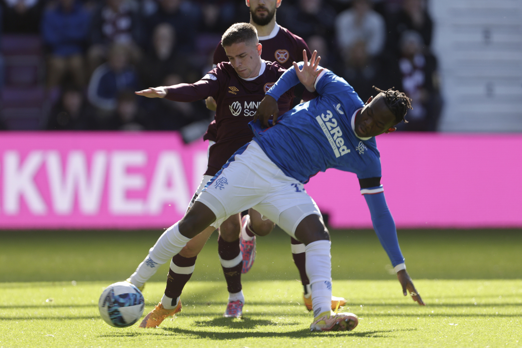 Hearts manager Robbie Neilson argues referee could have shown Cammy Devlin a yellow card for Rabbi Matondo foul