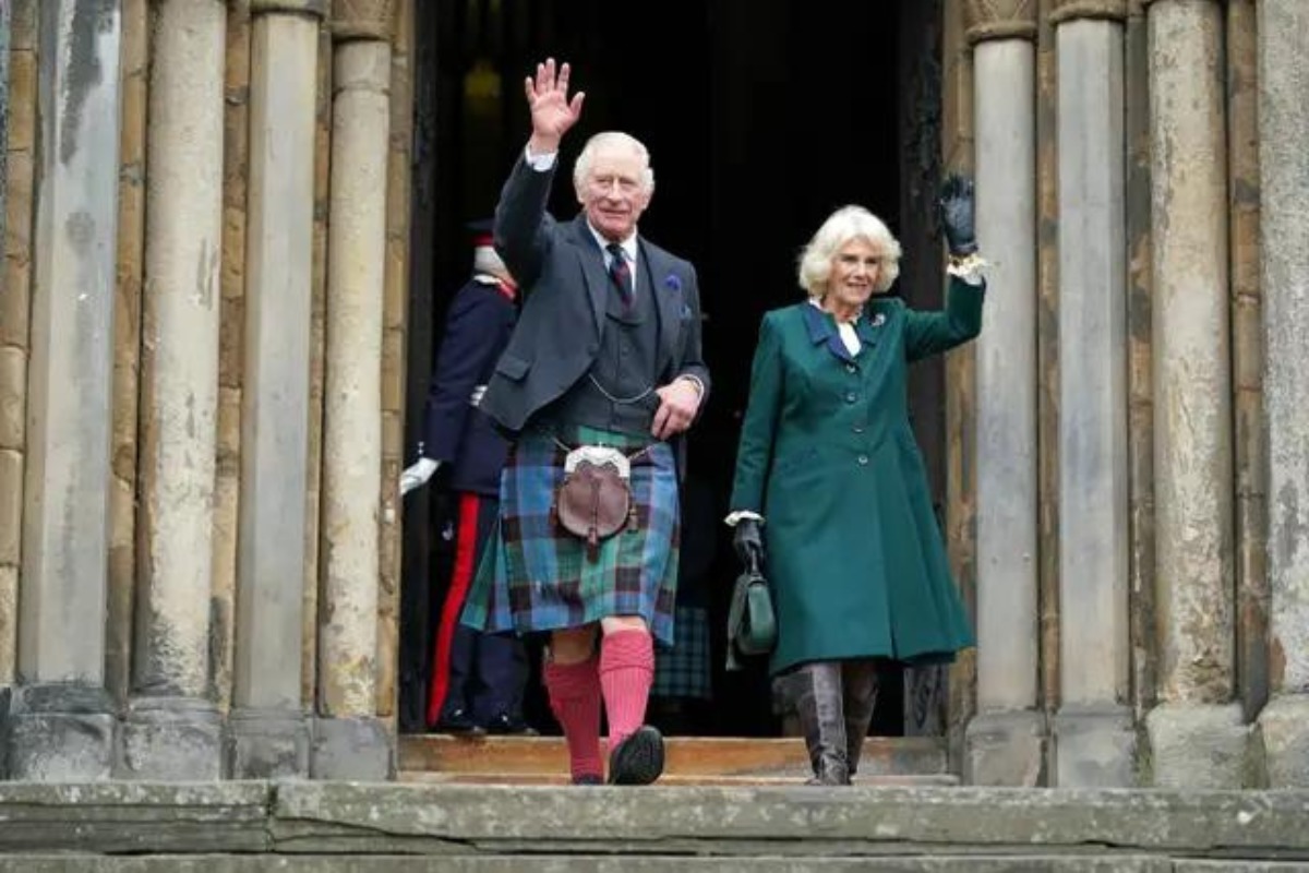 King Charles and Camilla, Queen Consort, wave as they leave Dunfermline Abbey.