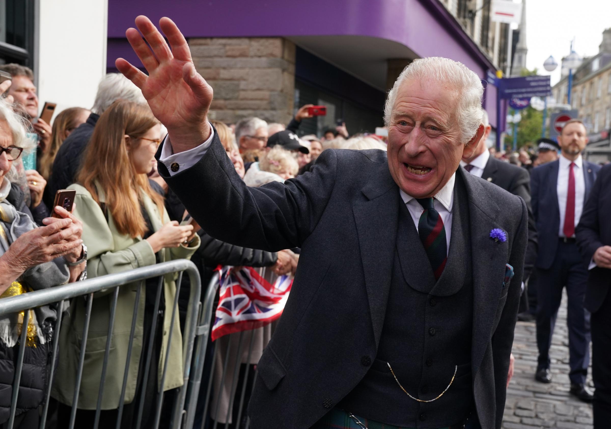 King Charles III meets the public on a walk about after attending an official council meeting at the City Chambers in Dunfermline, Fife.