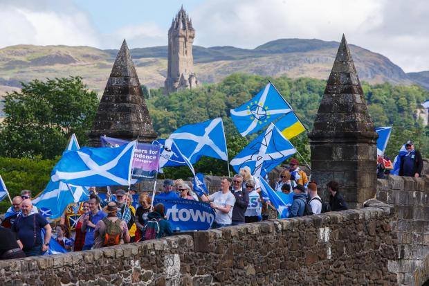 Independence supporters marching from Stirling old bridge to Bannockburn. ..Photograph by Colin Mearns.25 June 2022.