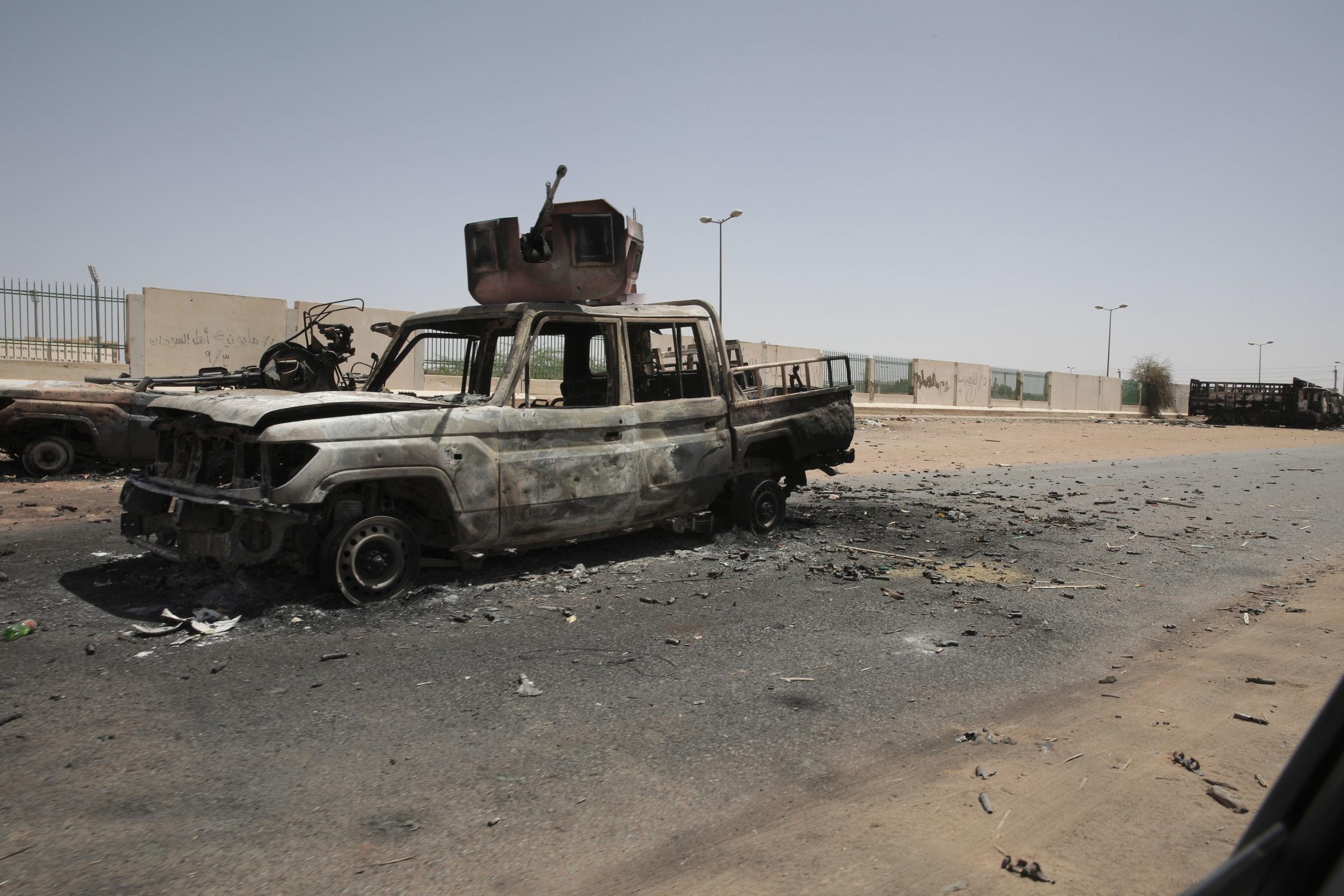Destroyed military vehicles are seen in southern in Khartoum, Sudan, Thursday, April 20, 2023. The latest attempt at a cease-fire between the rival Sudanese forces faltered as gunfire rattled the capital of Khartoum. Through the night and into Thursday