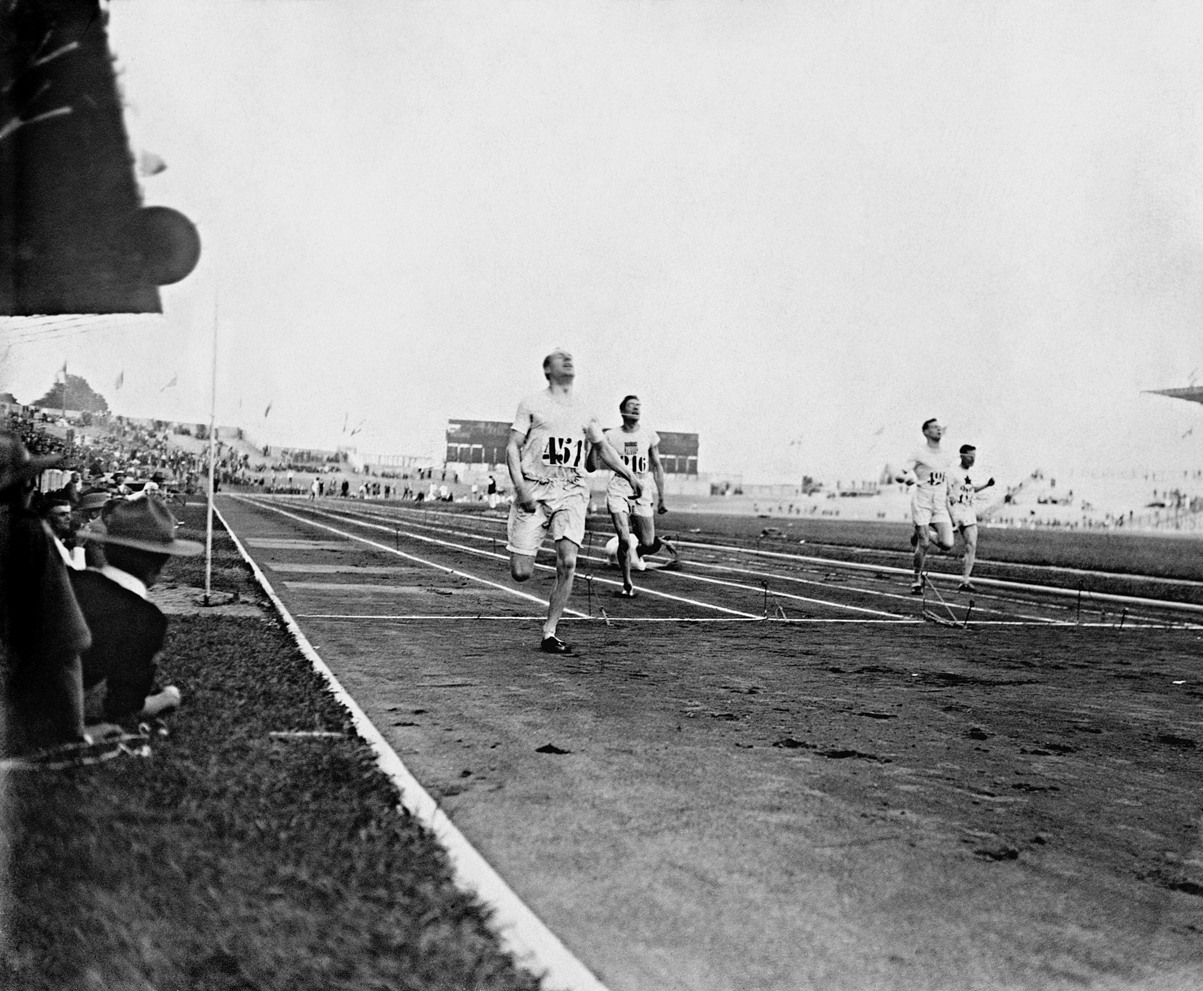 Great Britains Eric Liddell crosses the line first to win the Gold Medal. Eric Liddell was due to compete in the 100 metres race but as a committed Christian he refused to run on a sunday. He was later portrayed in the film Chariots of Fire..
