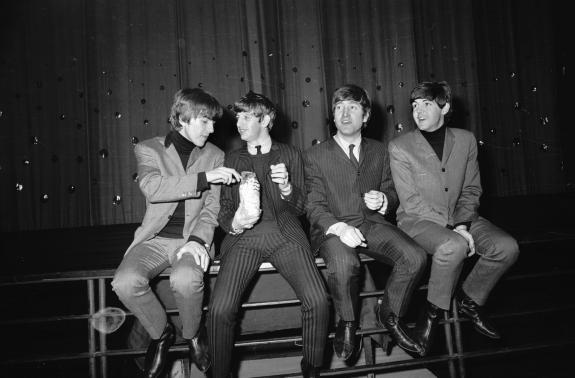 The Herald: The Beatles eat a bag of popcorn during a photocall at Lewisham Theatre, London, on December 9, 1963 The Herald: The Beatles eat a bag of popcorn during a photocall at Lewisham Theatre, London, on December 9, 1963