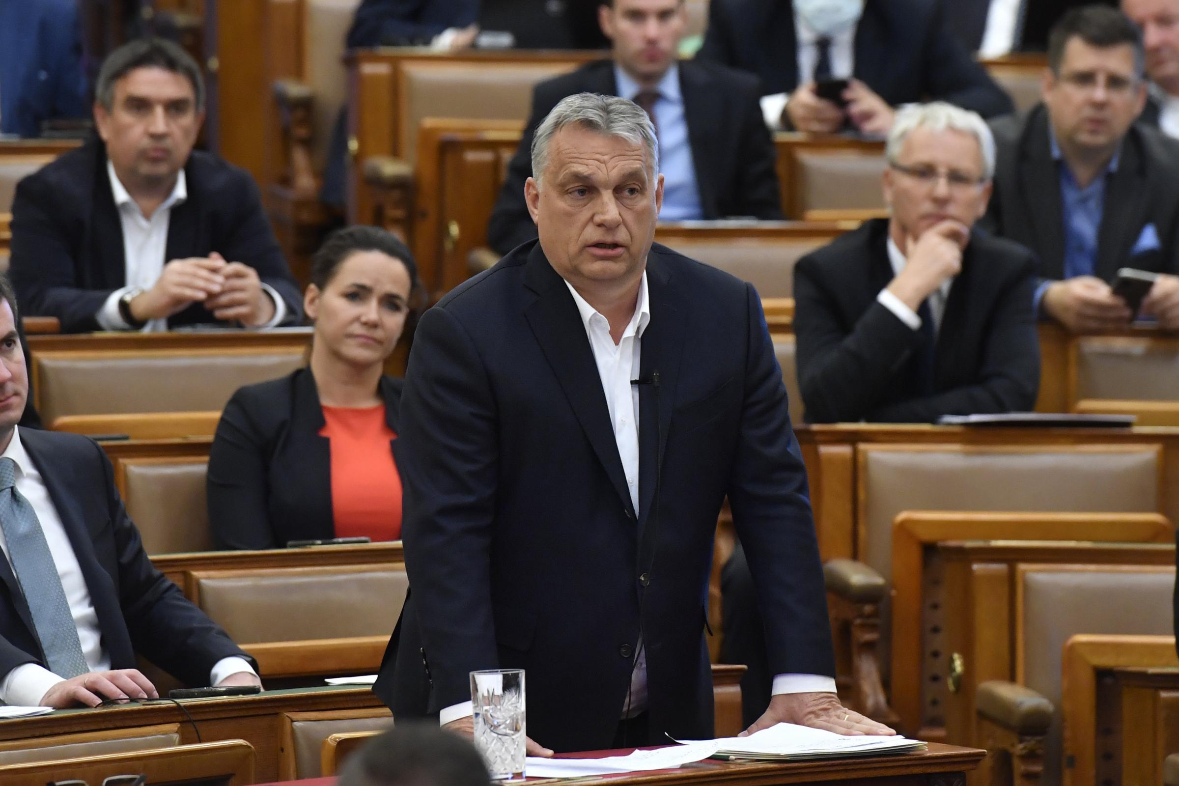 Hungarian Prime Minister Viktor Orban replies to an oppositional MP during a question and answer session of the Parliament in Budapest, Hungary, Budapest, Hungary, Monday, March 30, 2020. Hungarys parliament on Monday approved a bill giving Prime