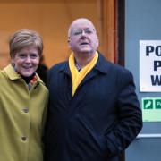 SNP leader Nicola Sturgeon with husband Peter Murrell as they cast their votes in the 2019 General Election at Broomhouse Park Community Hall in Glasgow. PA Photo. Picture date: Thursday December 12, 2019. See PA story POLITICS Election. Photo credit