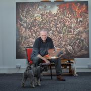 Peter Howson photographed in his Glasgow studio with his new artwork Massacre of Srebrenica. Picture: Kirsty Anderson/The Herald