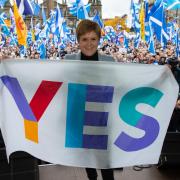 The National rally for independence, George Square, Glasgow...First Minister Nicola Sturgeon holds a yes flag on stage...  Photograph by Colin Mearns.2 November 2019...