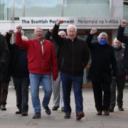 Former miners outside the Scottish Parliament as the Scottish Government responded to recommendations made by the Independent Review of the Policing of the 1984/85 Miners' Strike. The miners were pardoned in 2022.
