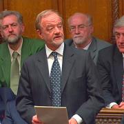 Robin Cook photographed making his resignation speech in the House of Commons in March 2003.. He is looked on by Jeremy Corbyn,  back left, and other Labour MPs. Photo PA.