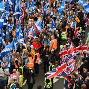 Rival sides confront each other in a march for independence