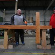 Joe Kilmartin and Scott McIlwriath add final touches to remembrance cross