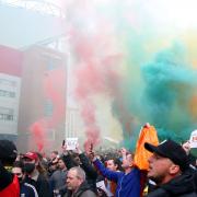 Manchester United fans storm Old Trafford to protest against Glazers on pitch