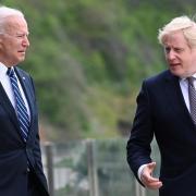 US President Joe Biden (left) talks with Prime Minister Boris Johnson, during a walk outside Carbis Bay Hotel, Carbis Bay, Cornwall, ahead of the G7 summit in Cornwall