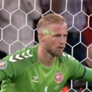 UEFA is investigating an incident in which a laser pointer was directed at Denmark goalkeeper Kasper Schmeichel