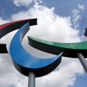 The colours of the three agitos matches the those of the Olympic rings