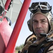 Presenter James Crawford in a Tiger Moth during filming of BBC series Scotland from the Sky. Picture: BBC Studios