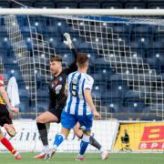 Zak Rudden lifts the ball over Killie keeper Zach Hemming at Rugby Park