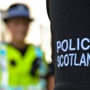 Police have charged a third man after the death of a man in Greenock last year