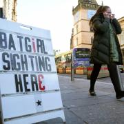 A member of the public passes a sign in Glasgow, near the film set of the new Batgirl movie  Picture: Andrew Milligan/PA Wire
