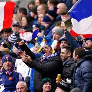 France fans in the stands celebrate during the Guinness Six Nations match at Murrayfield Stadium, Edinburgh. Picture: PA