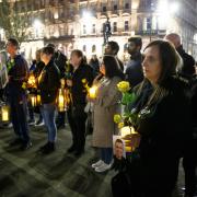 Vigil at George Square, Glasgow  to mark the second national lockdown anniversary. The event attended by families who lost loved ones in the covid pandemic was organised by Covid 19 Families Scotland. Pictured are people holding lanterns and yellow roses