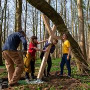 Artist Alec Finlay, at right, installing the first of the Covid memorial tree supports in Pollok Country park, Glasgow. Pictured with Alec, are from left, Alastair Leitch, Rachel Smith and Kate McAllan. Photograph by Colin Mearns.