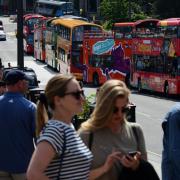 Tourists keep city tour buses busy as the Edinburgh Festival Fringe gets under way, on August 3, 2019 in Edinburgh, Scotland. Photo by Ken Jack/Getty Images.