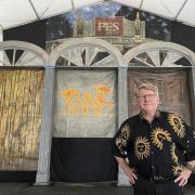 Quint Davis, producer of the New Orleans Jazz & Heritage Festival, stands on a stage of the festival’s Blues Tent on Tuesday, April 26, 2022. The festival opens on Friday, April 28, for the first time in three years, having been postponed in