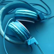 Blue headphones. Credit: Canva