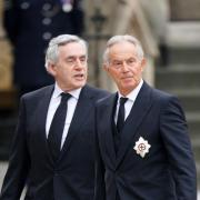 Former prime ministers Tony Blair (right) and Gordon Brown arriving at the State Funeral of Queen Elizabeth II, held at Westminster Abbey, London.