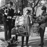 The Beatles try their hands at bagpipes on a trip to Scotland