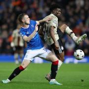 Leon King of Rangers challenges Mohammed Kudus of AFC Ajax during the UEFA Champions League group A match between Rangers FC and AFC Ajax at Ibrox