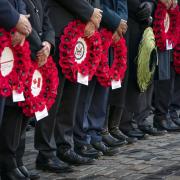 Dignitaries with poppy wreaths during the Remembrance Sunday service and parade in Edinburgh